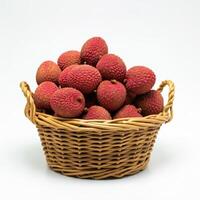Whole fresh lychee spilling from a basket onto a white background, showcasing its texture and juiciness photo