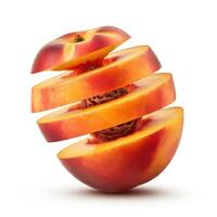 Sliced peach fruit with a green leaf set against a white backdrop. photo