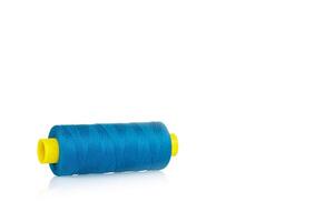 a skein of threads of blue color macro on a white photo