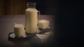 A Beautiful Presentation of Fresh Milk and Cheese Set Delightfully on a Dining Table video
