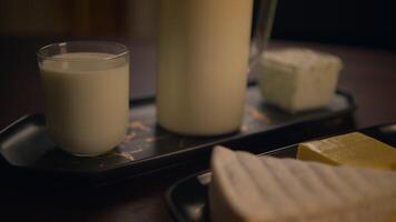 Fresh Dairy Products Displayed Beautifully on a Rustic Wooden Table Setting for Enjoyment video