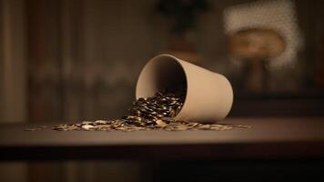 Spilled Coins from a Cup on a Beautiful Wooden Table, Creating a Unique Aesthetic Display video
