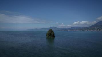 A Serene Islet That Is Surrounded by the Most Tranquil Waters Beneath a Beautiful Blue Sky video