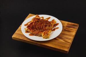 Delightful apple puff pastry drizzled with rich caramel sauce served elegantly photo