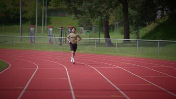 An Athlete Engaged in Running on a Track with Concentration and Determination is Inspiring video