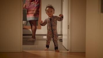 A Playful Child Dressed in Cozy Pajamas, Enjoying Moments of Pure Joy and Freedom video