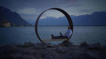 Finding Peace and Serenity in Nature A Man Enjoying Relaxation by the Calm Water Body video