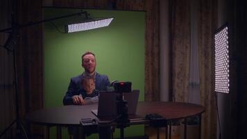 Interview Setup Featuring a Green Screen and Engaging FatherChild Interaction Dynamics video