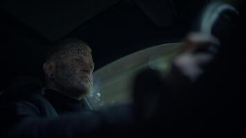 An Intense Driver Fully Focused on the Open Road Exhibiting Intriguing and Unique Tattoos video