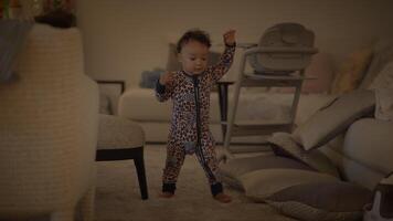 A Child Dressed in Cozy Pajamas Happily Playing and Exploring at Home with Joyful Energy video