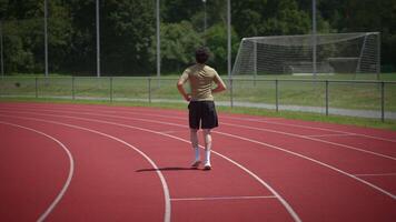 Runner on the Track A Dynamic Healthy Lifestyle in Action and Movement Towards Fitness video