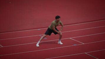 An Athlete Getting Ready for a Sprint on the Athletic Track to Compete in Their Event video