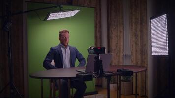Engaging in a Professional Shoot in a Studio Featuring a Green Screen Background video