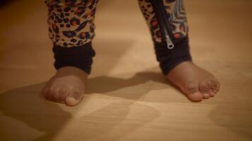 Exploring on the Floor A Childs Bare Feet Playfully on a Beautiful Wooden Surface video