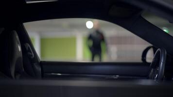 An intriguing and mysterious encounter unfolds in a dimly lit car park, inviting exploration video