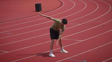 An Extremely Exhausted Athlete on the Track After Completing a Very Rigorous Sprinting Session video