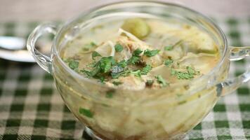 Diet chicken soup with vegetables in a plate for lunch. video