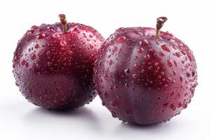 Two plums with water droplets on them photo