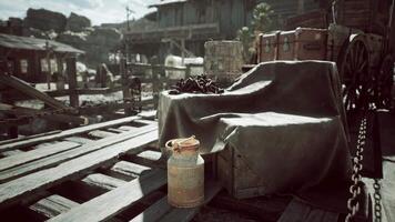 Rustic wooden dock with crates and a milk can under the bright sun video