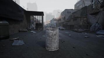 Abandoned street with a rusted barrel and debris in a desolate urban area video