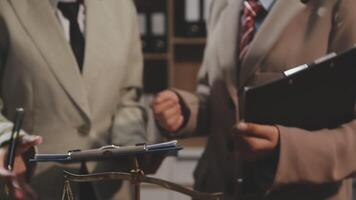 Two business people are holding a scale and a folder video