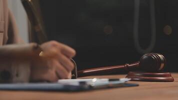 A judge's gavel on a wooden table video