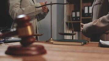 A judge's gavel and a scale on a desk video
