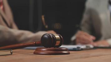 Lawyer and judge sitting at a desk with a gavel video