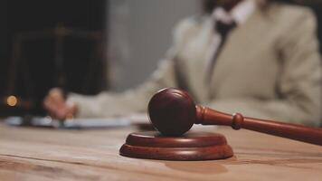 Judge's gavel on wooden table video