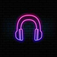 Glowing neon line headphones with microphone icon isolated on brick wall background. Conceptual object for listening to music, service, communication and operator. Colorful outline concept. vector