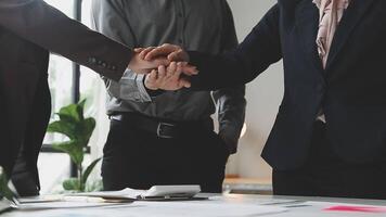 Three business people shaking hands over a table video