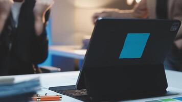 A laptop sitting on a desk with a person sitting in front of it video