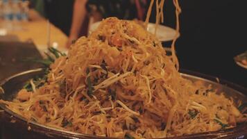 A bowl of noodles being lifted up by a fork video