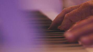 A close up of a person's hands playing the piano video