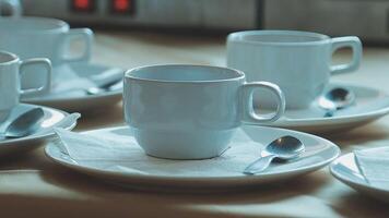 Coffee cups and saucers on a table video