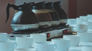 Coffee makers and cups on a table video