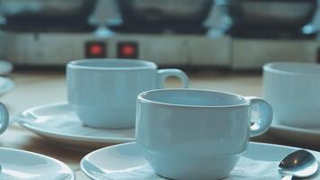 Coffee cups and saucers on a table video