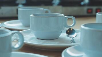 Coffee cups and saucers on a table video