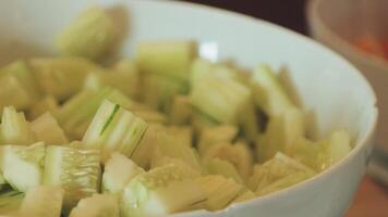 A bowl of sliced cucumbers sitting on a table video