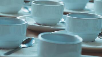 A table with many cups and saucers on it video