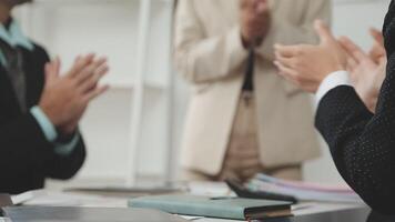 Business people clapping at a meeting video