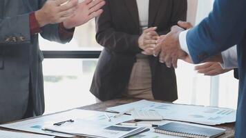 Business people shaking hands at a table video