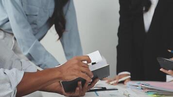 Business people working together at a desk video