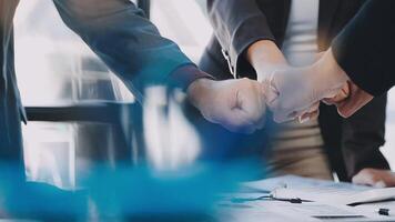Business people shaking hands over a table video