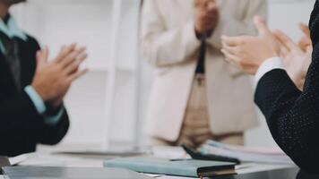Business people clapping at a meeting video