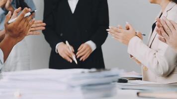 Business people clapping at a meeting video