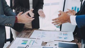 Business people shaking hands at a table video