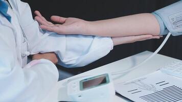 A doctor is checking the blood pressure of a patient video