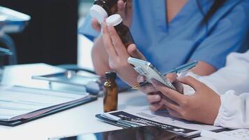 A doctor is using a cell phone and a pen video