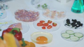 A table with various ingredients including eggs, tomatoes, cucumbers, and other vegetables video
